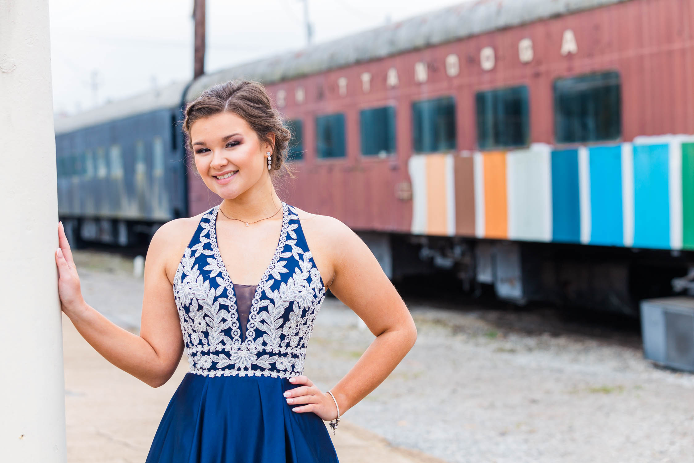 Girl posing for beautiful outdoor portraits before prom in Chattanooga, Tennessee at the Choo Choo