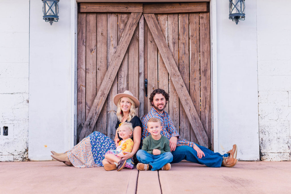 North Georgia Family Photos at Mountain Cove Farms, family poses in front of barn doors in Chickamauga, Georgia 