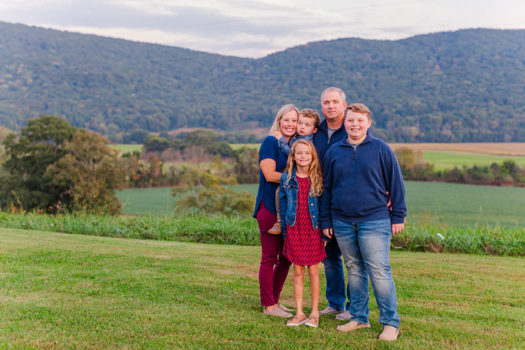 North Georgia Family Photos at Mountain Cove Farms, family poses in front of beautiful mountain view in Chickamauga, Georgia