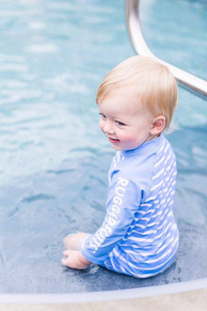 Happy boy smiles and splashes at Pool Party Mini Sessions in Rossville, Georgia by local photographer Elle Bea Photography