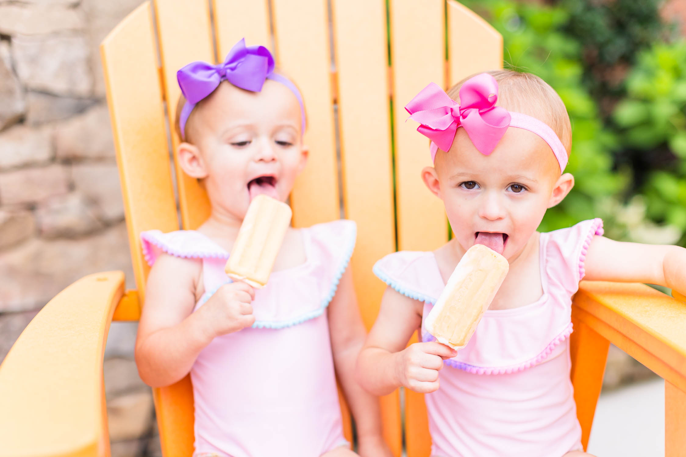 Happy kids eat ice cream bars at Pool Party Mini Sessions in Rossville, Georgia by local photographer Elle Bea Photography