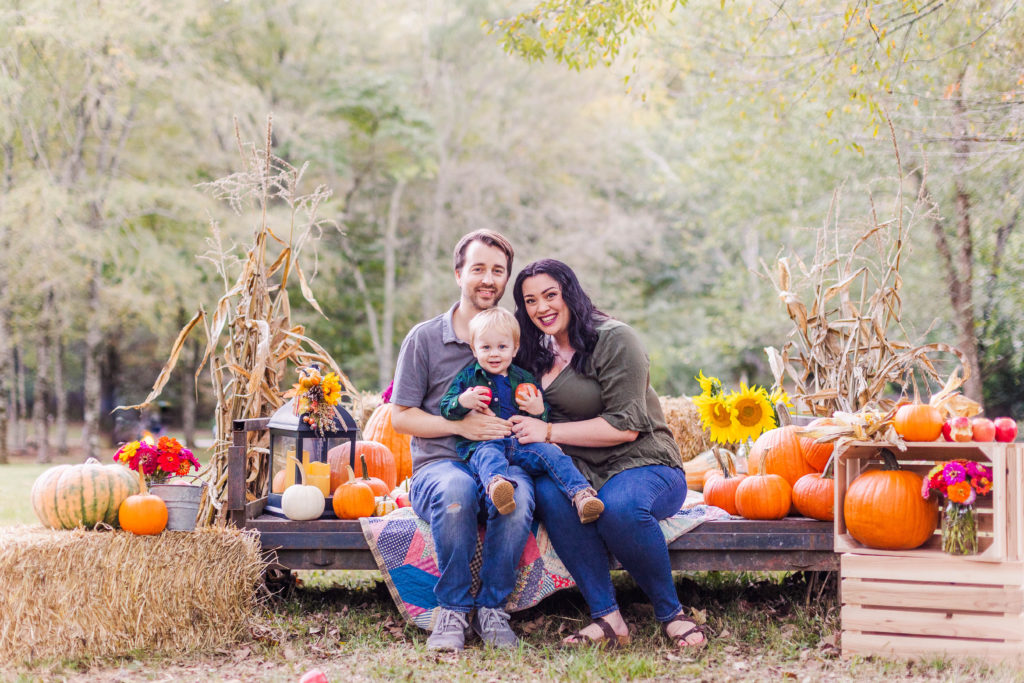 Family smiles in a fall set designed for Chattanooga Farm Mini Sessions in Hixson, Tennessee