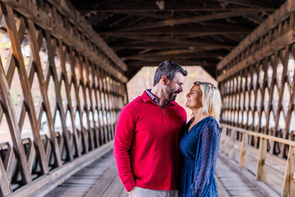 Couple shares a smile on the bridge at Stone Mountain Park in Stone Mountain, Georgia