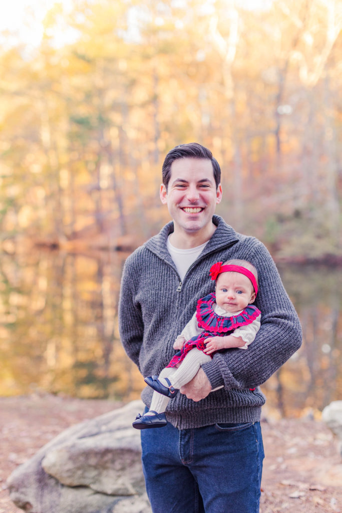 Father baby daughter smile during 2022 family photography at Stone Mountain Park in Stone Mountain, Georgia
