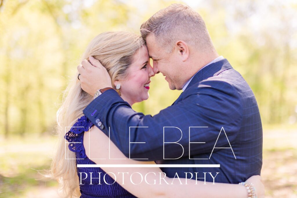 Sweet couple smiles and nuzzles during Spring Family Mini Sessions