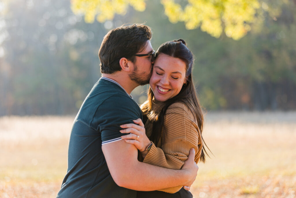 Newly engaged couple share a sweet moment during photography of their Chickamauga Battlefield proposal